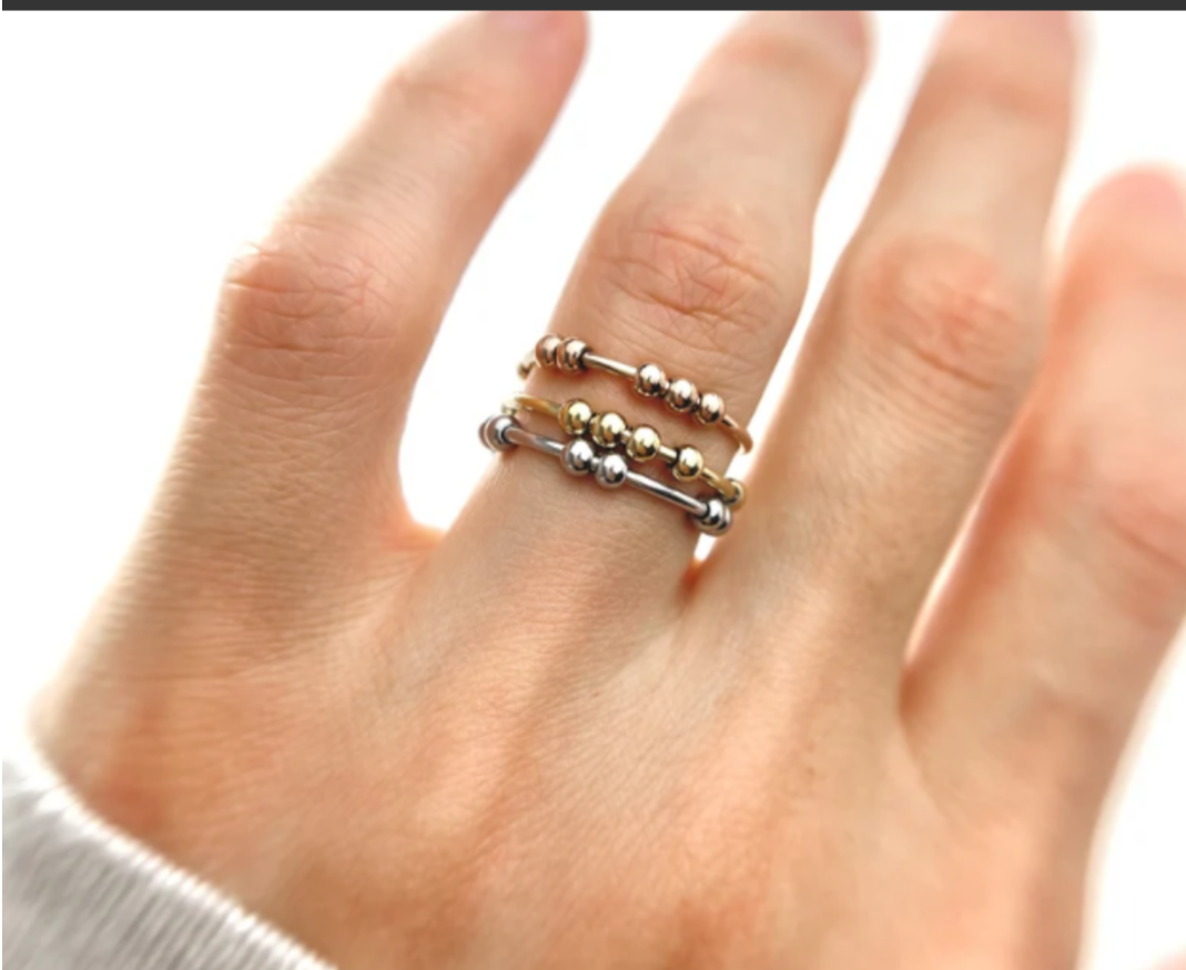 3 fidget rings on a hand